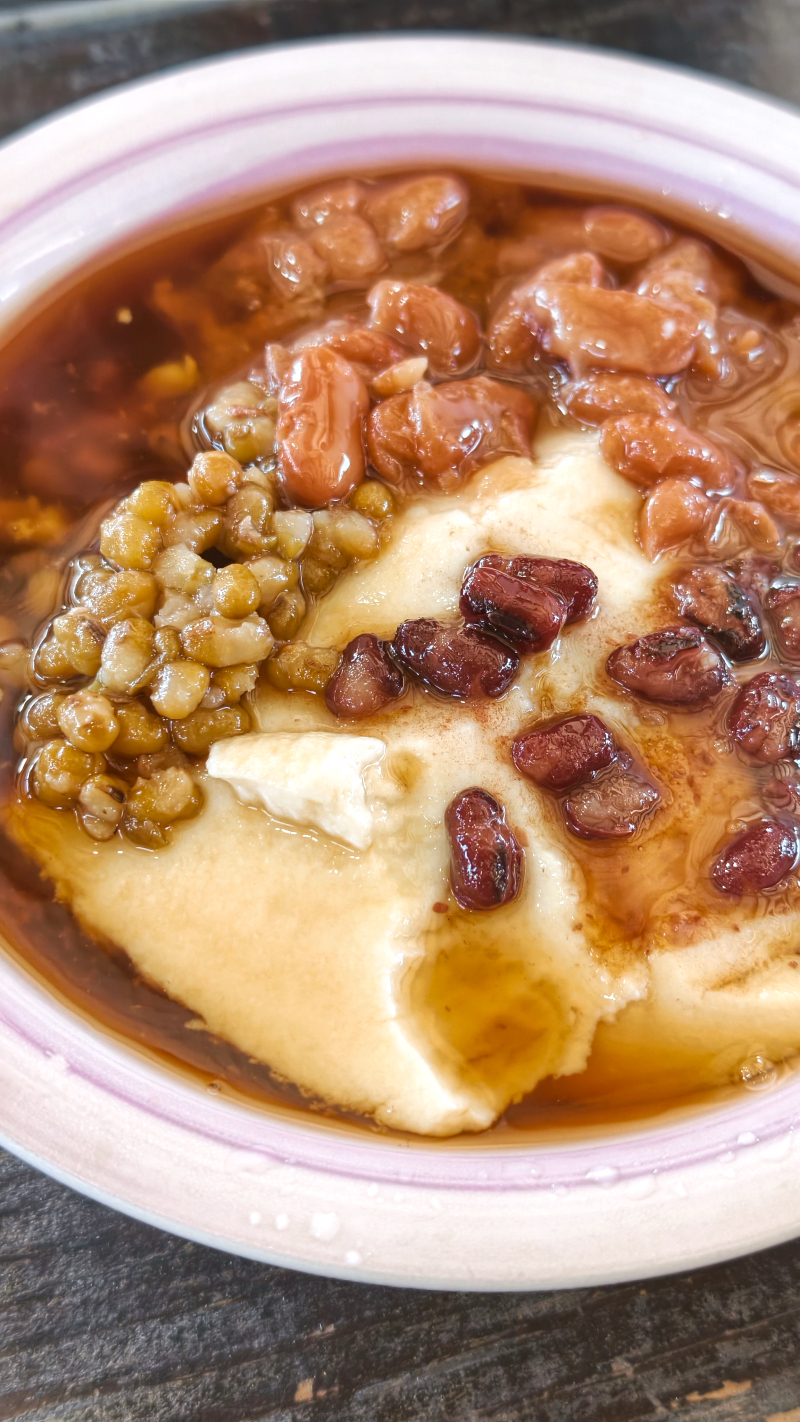 Douhua, silken tofu, makes a great dessert with sweetened red beans.